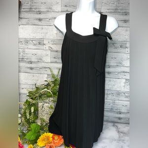 Black Sleeveless pleated dress with bow. Size 4p By Bobbie Bee.